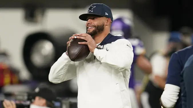 Mandatory Credit: Photo by Jim Mone/AP/Shutterstock (12581553i)Injured Dallas Cowboys quarterback Dak Prescott stands on the field before an NFL football game against the Minnesota Vikings, in MinneapolisCowboys Vikings Football, Minneapolis, United States - 31 Oct 2021.