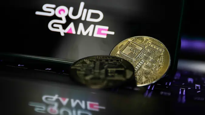POLAND OUTMandatory Credit: Photo by Jakub Porzycki/NurPhoto/Shutterstock (12582594a)Representation of cryptocurrency and Squid Game logo displayed on a phone screen in this illustration photo taken in Krakow, Poland on October 30, 2021.