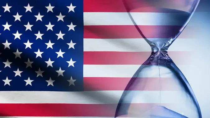 Stars and Stripes American flag with an hourglass stock photo