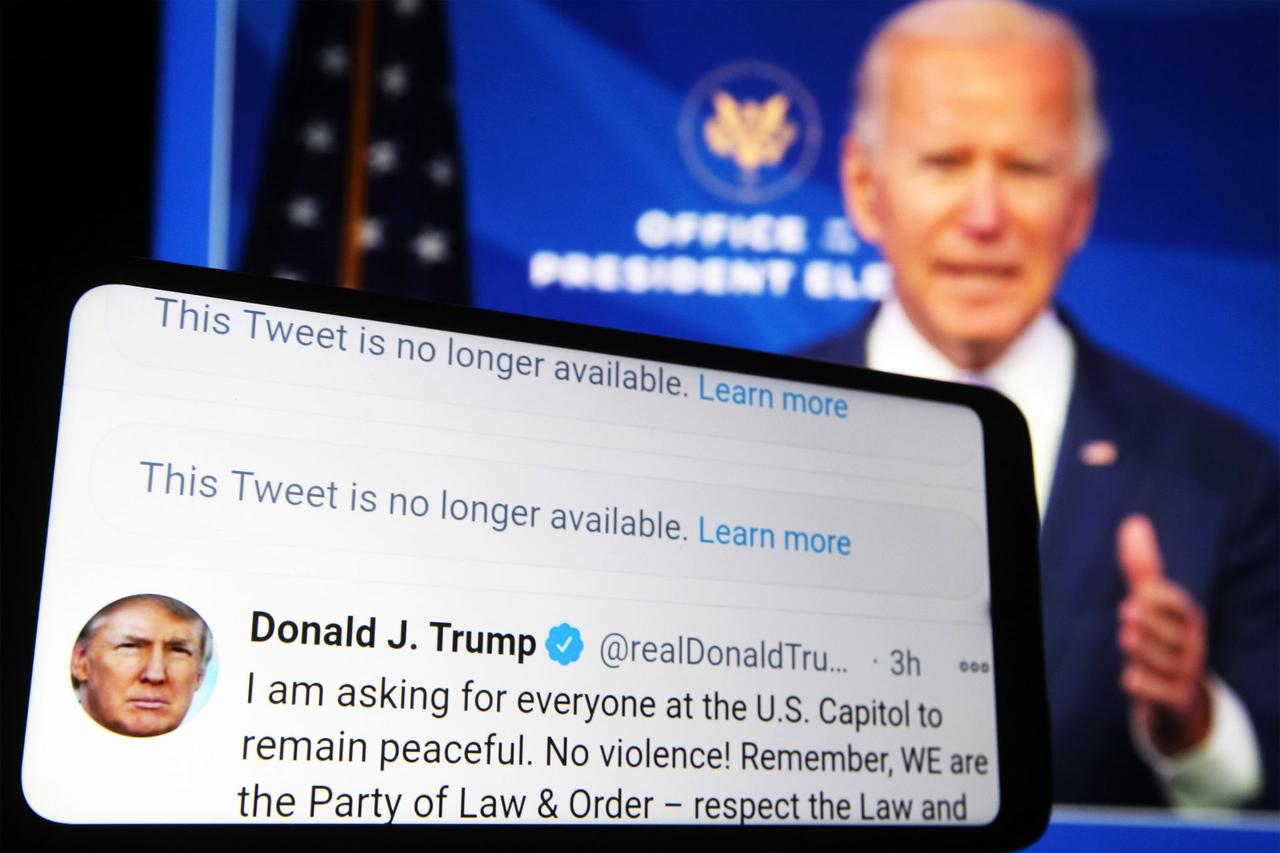 Mandatory Credit: Photo by Pavlo Gonchar/SOPA Images/Shutterstock (11695795d)In this photo illustration, Donald Trump Twitter messages are seen displayed on a smartphone screen in front of a fragment of a video with U.
