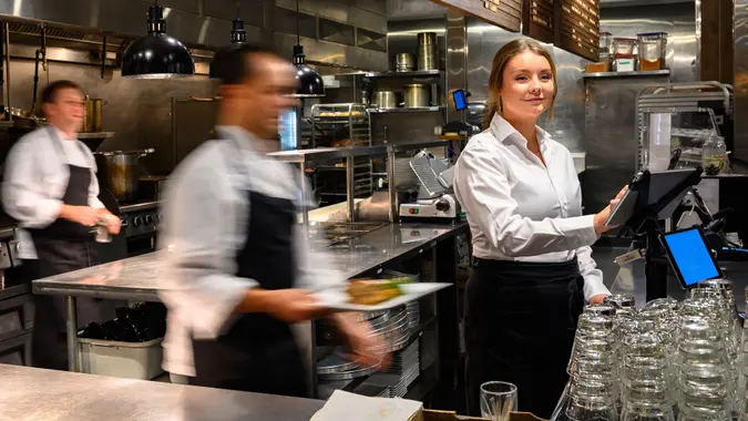 Server adding a new order with a tablet stock photo