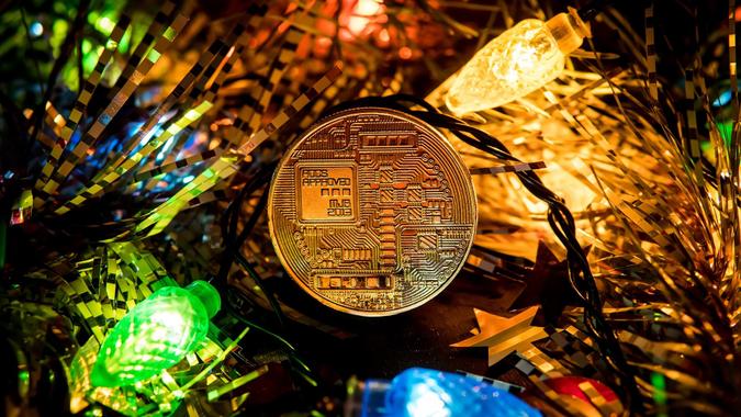 Gold bitcoin decoration on christmas tree stock photo