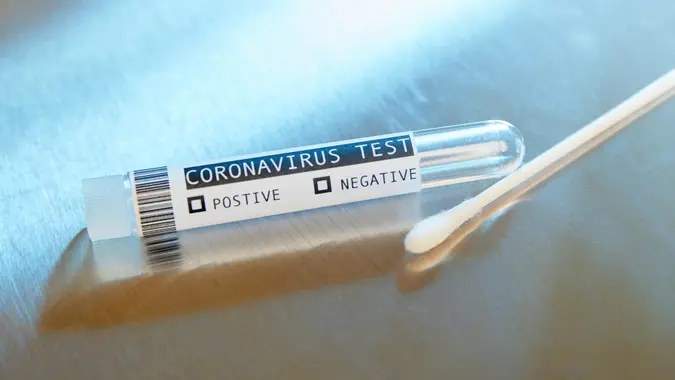 Blank Covid-19 Coronavirus test on stainless steel surface table.