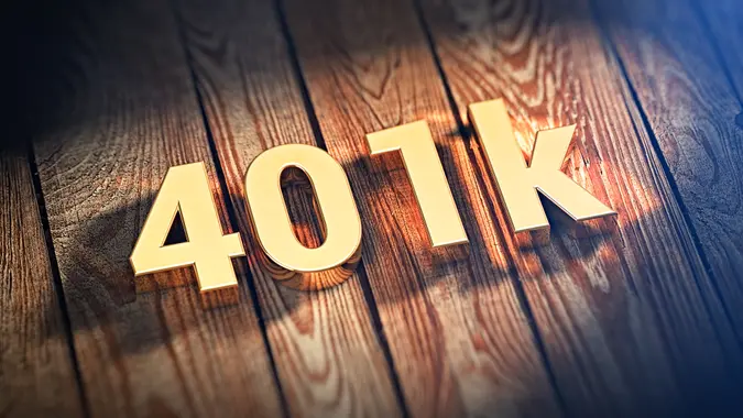 The sign "401k" is lined with gold letters on wooden planks.