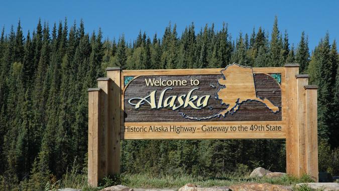 Alaska welcomes visitors on the Alaska Highway at the Alaskan border,Alaska,USA.