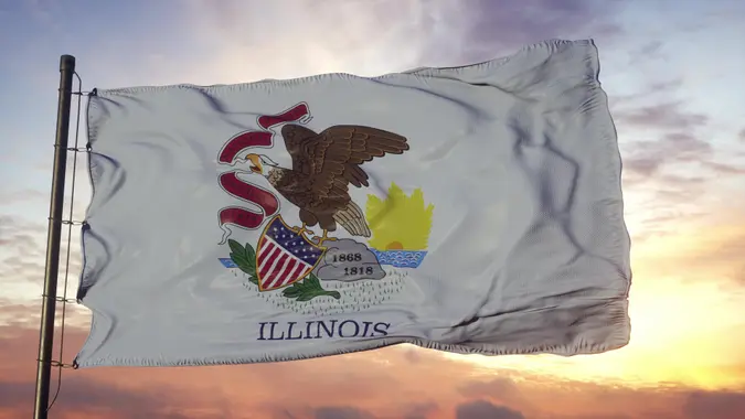 Flag of Illinois waving in the wind against deep beautiful sky.