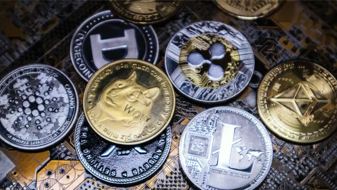 Antalya, Turkey - April 25,  2021: Close up shot of alt coins cryptocurrency over computer circuit.