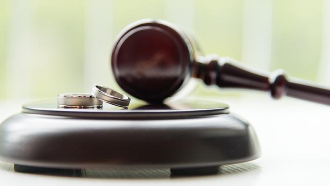 Gavel and wedding rings, for divorce concept.
