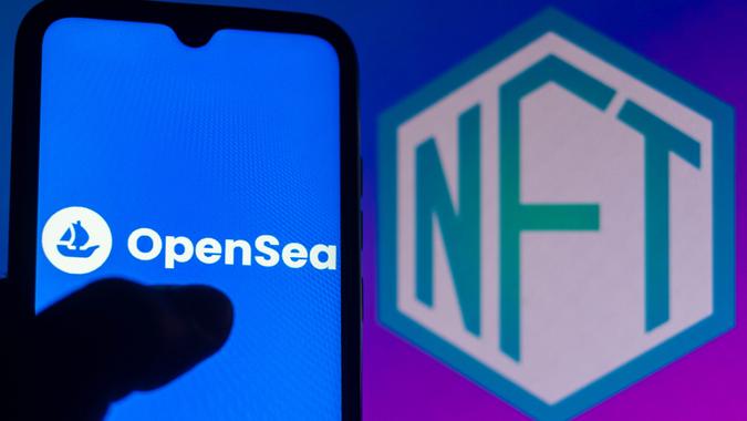 Mandatory Credit: Photo by Rafael Henrique/SOPA Images/Shutterstock (12360860i)In this photo illustration the OpenSea logo seen displayed on a smartphone with the NFT (Non-fungible token) logo In the background.