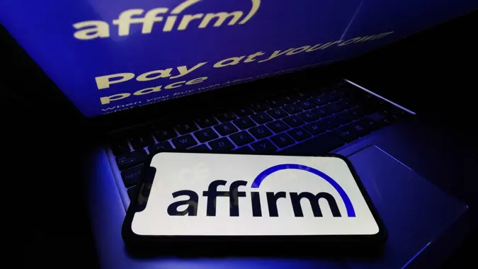 Mandatory Credit: Photo by Jakub Porzycki/NurPhoto/Shutterstock (12310762i)Affirm logo displayed on a phone screen and Affirm website displayed on a laptop screen are seen in this illustration photo taken in Krakow, Poland on August 16, 2021.