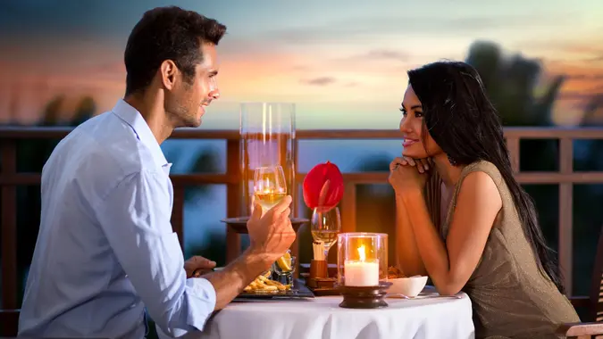 Couple on summer evening having romantic dinner stock photo