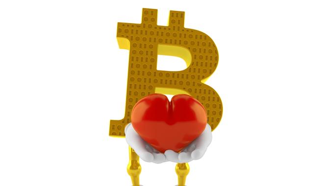 Bitcoin character holding heart isolated on white background.
