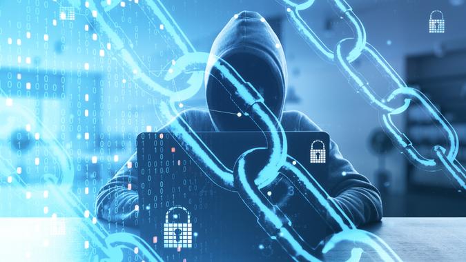 Internet security and data protection concept with noface hacker with laptop and digital screen with chain, coding numbers and locks.