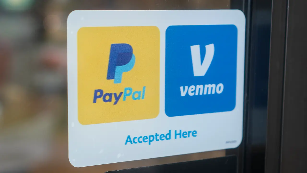 Sherwood, OR, USA - Oct 1, 2021: PayPal and Venmo Accepted Here sticker is seen at the entrance to a Panda Express restaurant in Sherwood, Oregon.