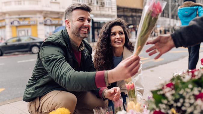 Man choose a bouquet for his lovely wife stock photo