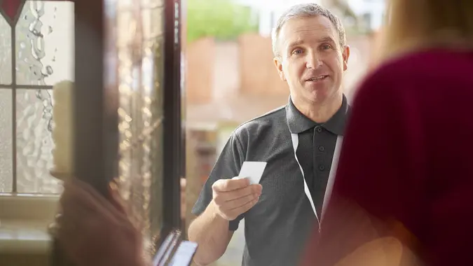 Salesman making house call stock photo