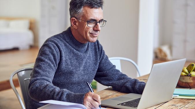 He works hard, from home or the office stock photo