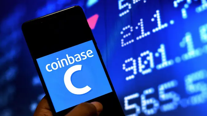 Mandatory Credit: Photo by Avishek Das/SOPA Images/Shutterstock (11863354e)In this Photo illustration of a Coinbase logo seen displayed on a Smartphone.