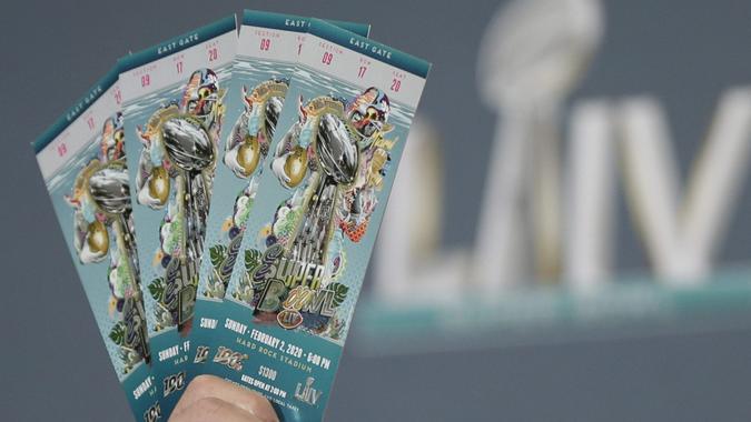 Mandatory Credit: Photo by John Angelillo/UPI/Shutterstock (12429092e)NFL Senior Counsel Michael Buchwald holds up authentic Super Bowl tickets at the NFL Super Bowl LIV counterfeit merchandise and tickets press conference at the Miami Beach Convention Center on Thursday, January 30, 2020 in Miami, Florida.