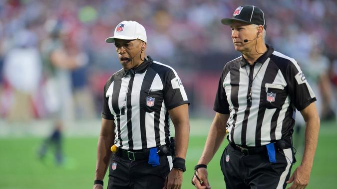 Mandatory Credit: Photo by John McCoy/AP/Shutterstock (12749906hu)Referee Shawn Smith (14) and down judge Mark Hittner (28) on the field as the Seattle Seahawks play the Arizona Cardinals during an NFL Professional Football Game, in PhoenixSeahawks at Cardinals, Phoenix, United States - 09 Jan 2022.