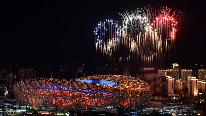 Mandatory Credit: Photo by Li Xin/AP/Shutterstock (12790184c)Fireworks, forming the Olympic rings, illuminate the sky during the opening ceremony of the 2022 Winter Olympics, in BeijingOlympics Opening Ceremony, Beijing, China - 04 Feb 2022.