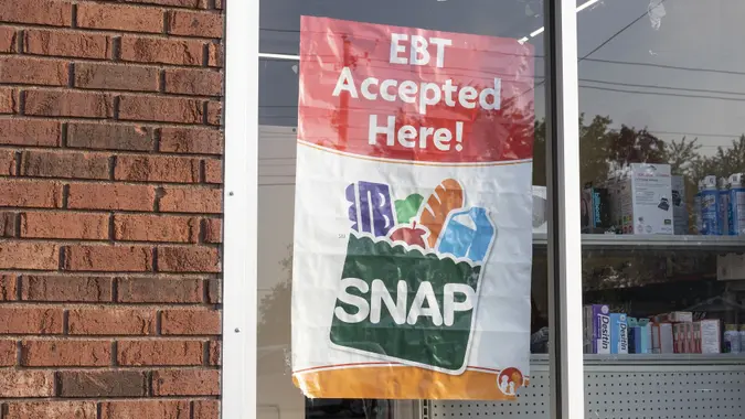 SNAP and EBT Accepted here sign. SNAP and Food Stamps provide nutrition benefits to supplement the budgets of disadvantaged families. stock photo