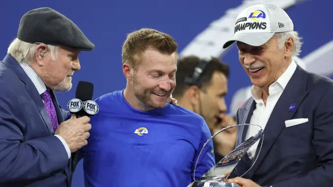 Mandatory Credit: Photo by Jed Jacobsohn/AP/Shutterstock (12782467gf)Los Angeles Rams owner Stan Kroenke, right, and head coach Sean McVay, middle, accept the George Halas trophy from Terry Bradshaw after the NFC Championship NFL football game against the San Francisco 49ers, in Inglewood, Calif.