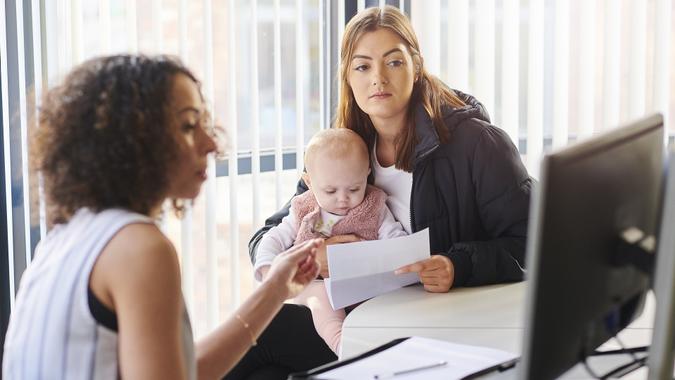 Young mother with support worker stock photo