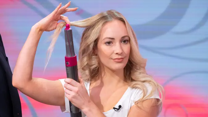 Editorial use onlyMandatory Credit: Photo by Ken McKay/ITV/Shutterstock (9933909aj)Model with Dyson 'The Airwrap''This Morning' TV show, London, UK - 16 Oct 2018This week Dyson launched a new hair product called ?The Airwrap? which they claim can curl, wave, straighten and blow dry - all without the extreme heat like other tools.