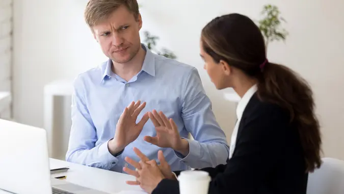 Millennial businessman rejecting giving interview to journalist stock photo