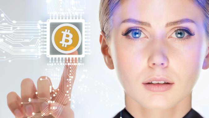 Businesswoman touching cryptocurrency Bitcoin circuit on virtual screen.