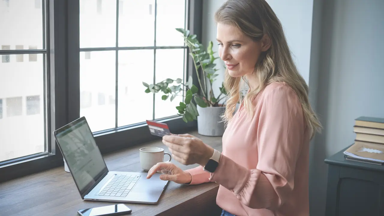 attractive middle aged woman working in the office.