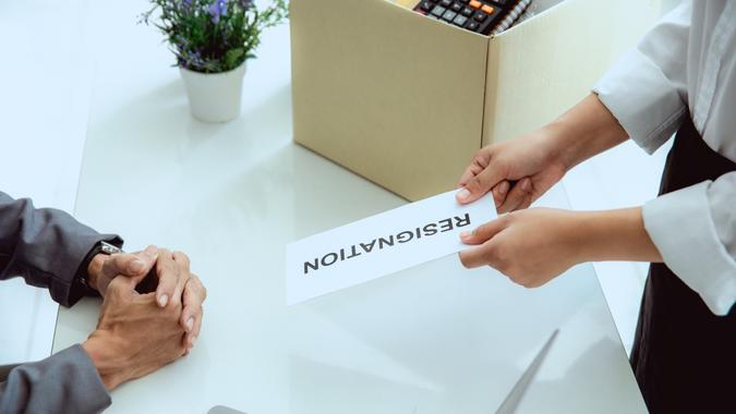 female office worker sending resignation letter to boss.