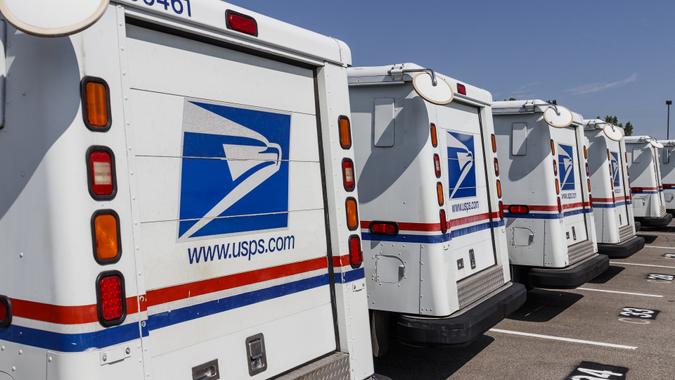 USPS Post Office Mail Trucks. The Post Office is responsible for providing mail delivery VIII stock photo