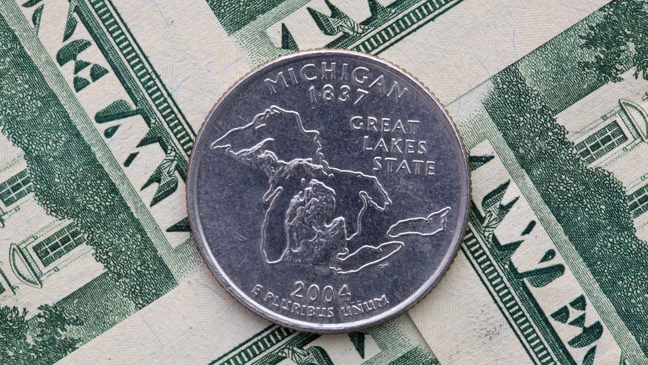 A quarter of Michigan on US dollar bills. stock photo