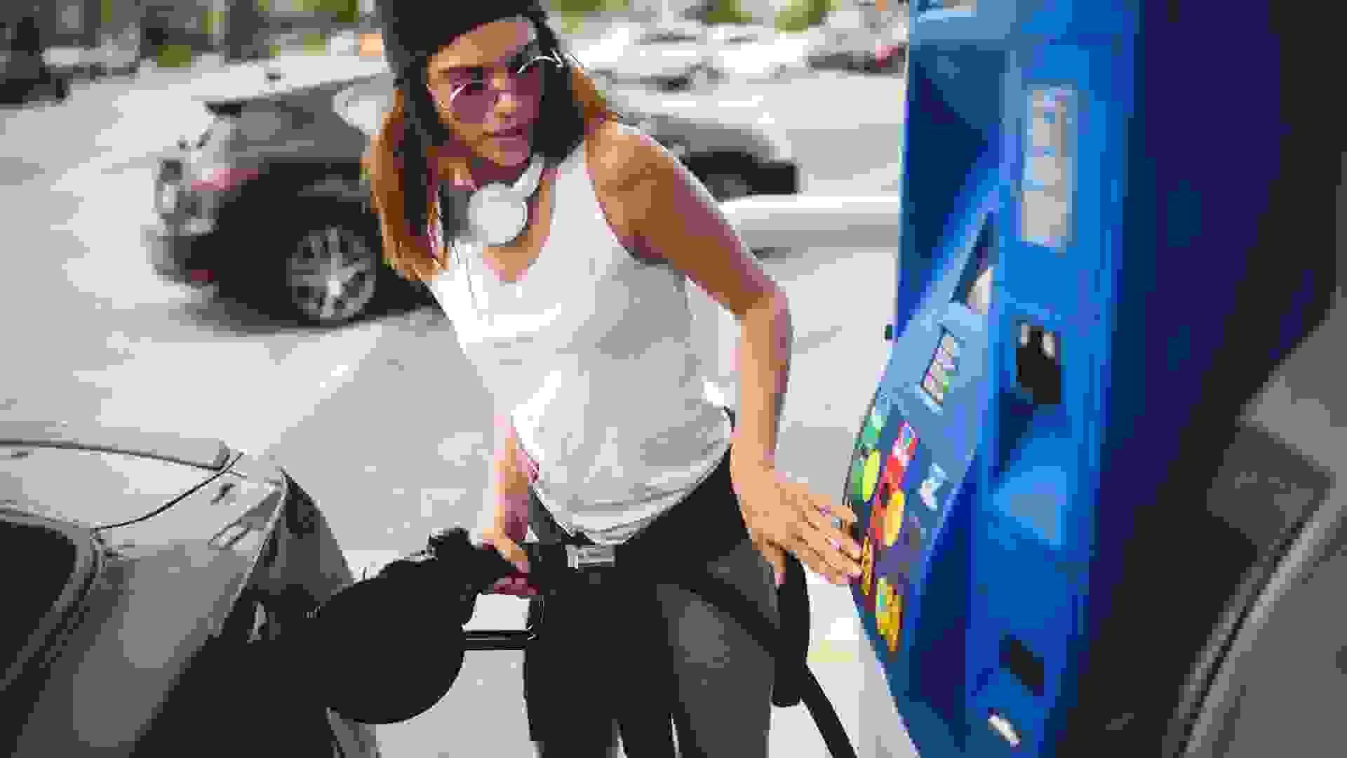 Woman at the gas station stock photo