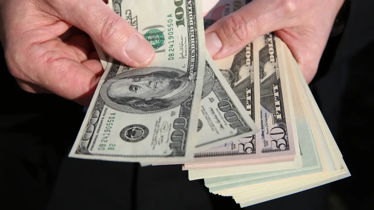 Businessman with US Dollars.