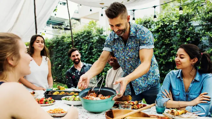 Group of diverse friends enjoying summer party together.