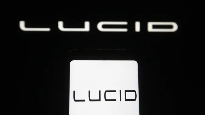Mandatory Credit: Photo by Pavlo Gonchar/SOPA Images/Shutterstock (11773507j)In this photo illustration, Lucid Motors logo of a company specializing in electric cars is seen displayed on a smartphone and pc screen.