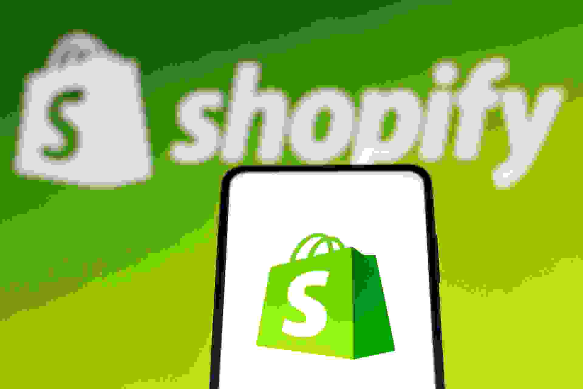 Mandatory Credit: Photo by Rafael Henrique/SOPA Images/Shutterstock (12601013c)In this photo illustration a Shopify logo seen displayed on a smartphone screen and in the background.