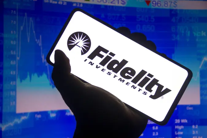 Mandatory Credit: Photo by Rafael Henrique/SOPA Images/Shutterstock (12603831l)In this photo illustration the Fidelity Investments logo displayed on a smartphone screen and a stock market graph in the background.