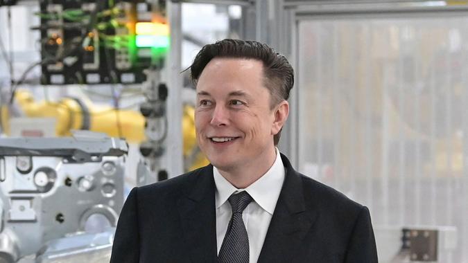 Mandatory Credit: Photo by Patrick Pleul/AP/Shutterstock (12861811f)German Chancellor Olaf Scholz, right, and Elon Musk, Tesla CEO attend the opening of the Tesla factory Berlin Brandenburg in Gruenheide, Germany, .