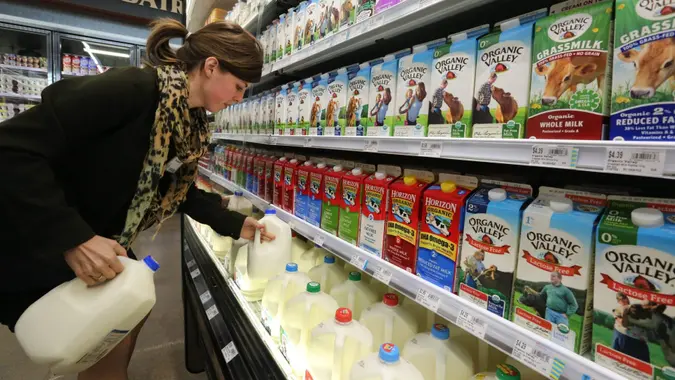Mandatory Credit: Photo by Brennan Linsley/AP/Shutterstock (6126122a)Reyna DeLoge Grocery and dairy assistant Reyna DeLoge stocks dairy products that only use milk from pasture-raised cows, at Vitamin Cottage Natural Grocers, in Denver.