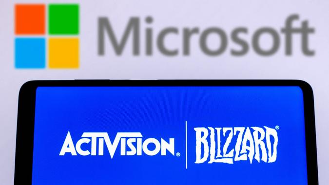 Mandatory Credit: Photo by Rafael Henrique/SOPA Images/Shutterstock (12787802ab)In this photo illustration Activision Blizzard logo seen displayed on a smartphone screen with a Microsoft Corporation logo in the background.