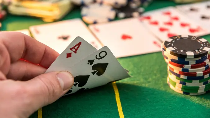 View of a gaming table with many poker card and chips green mat stock photo
