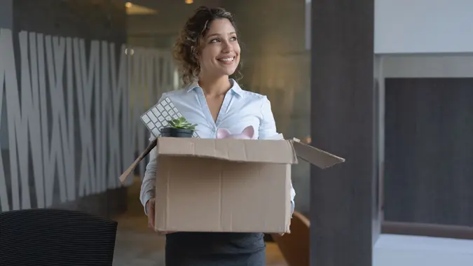 Business woman moving into a new office stock photo