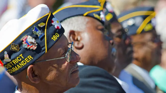 Belmont, North Carolina, USA - October 4, 2014: World War II Veterans give their attention to North Carolina Governor, Pat McCrory during a speech dedicating of a statue to honor the Veterans of World War II.