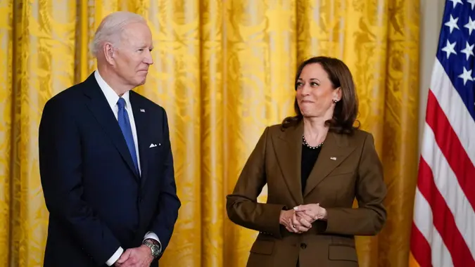 Mandatory Credit: Photo by Carolyn Kaster/AP/Shutterstock (12882678g)Vice President Kamala Harris looks at President Joe Biden as former President Barack Obama speaks about the Affordable Care Act, in the East Room of the White House in WashingtonBiden, Washington, United States - 05 Apr 2022.