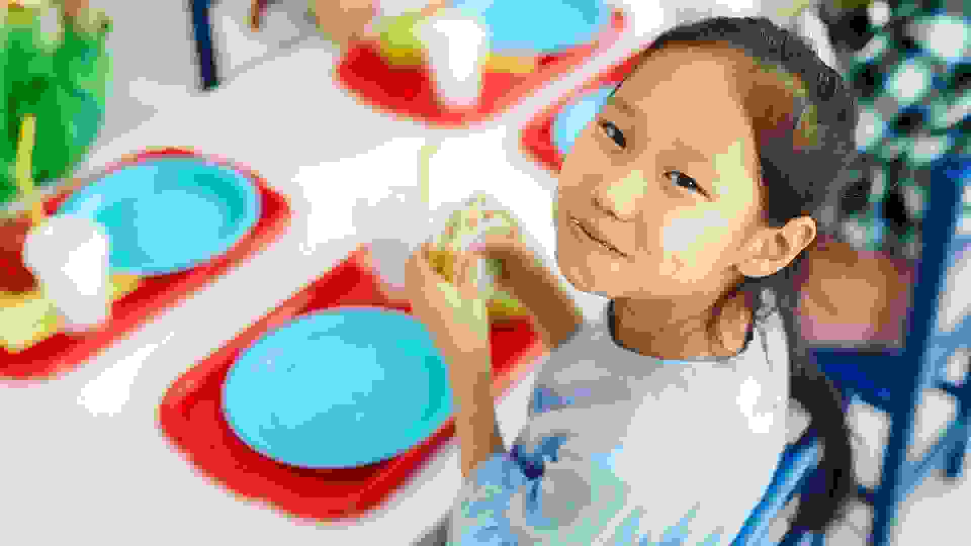 Happy girl eating school lunch stock photo