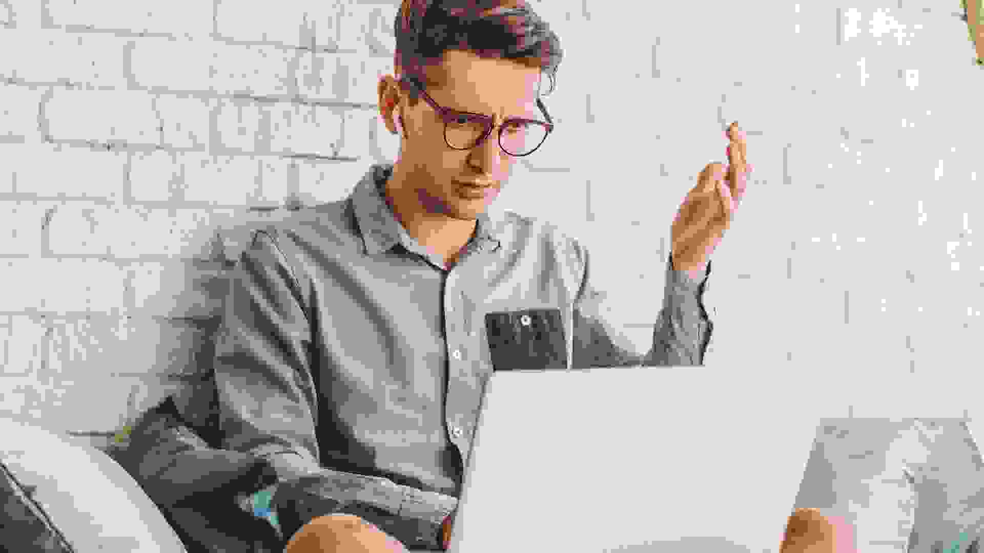 Confused businessman hipster freelancer feel puzzled while work at home stock photo